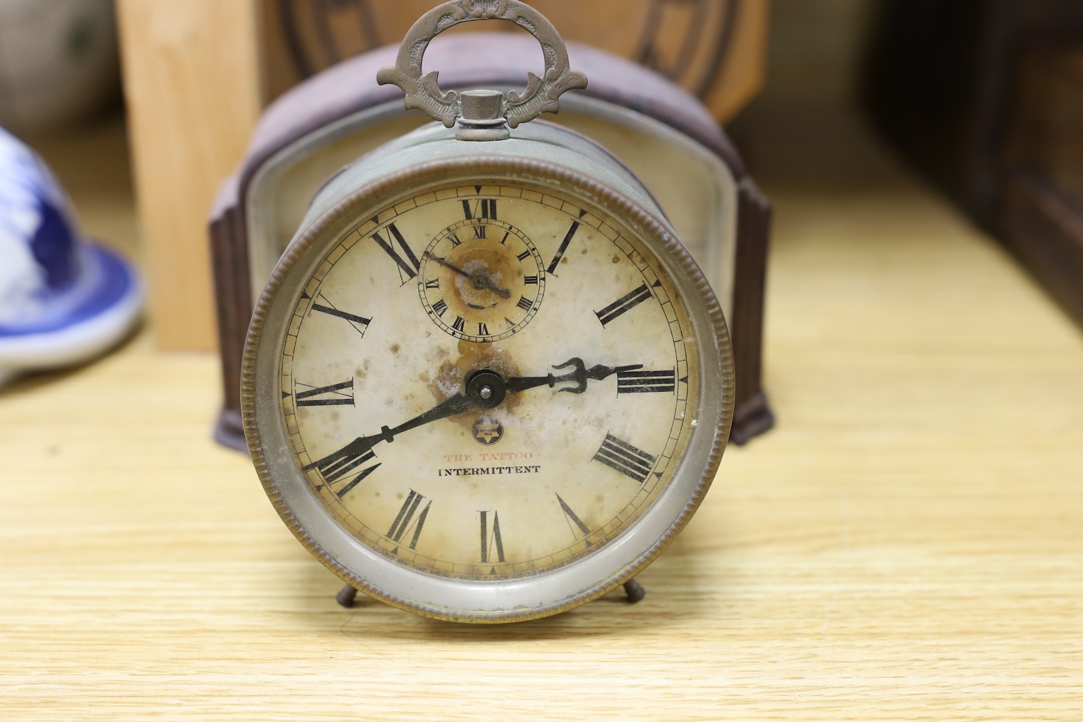 A Black Forest cuckoo clock, together with another octagonal faced timepiece, a Bakelite timepiece and another (4)